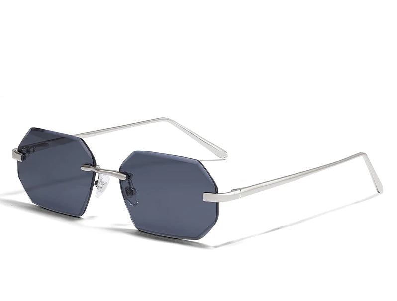 Gold-framed sunglasses with gradient brown lenses on a white background
