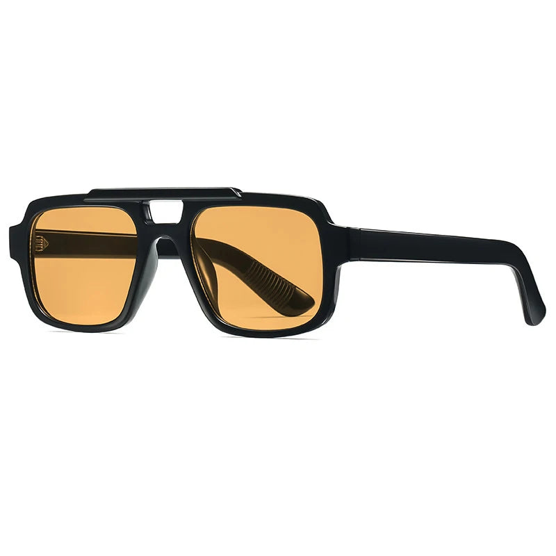 Sunglasses with black frame and orange-tinted lenses on a white background