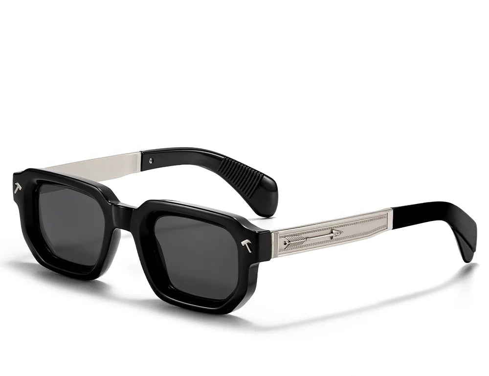 Sunglasses with black frames and dark lenses on a white background, featuring the Caterside brand.