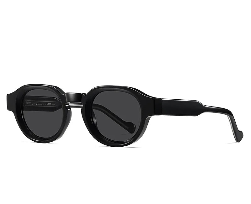Black sunglasses with a shiny black frame and gray lenses on a white background